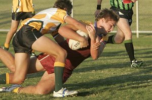 James Blanchard is pulled up short of the try line during their 26-12 win over Mount Austin High.