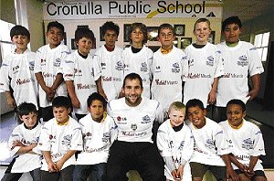 Ben Ross with pupils of Cronulla Public School. Picture: Lisa McMahon