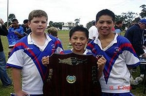 Happy trio: St George primary school pupils Jake Gallagher (left), Robert Siteine and Delane Cherrington show off the championship shield.