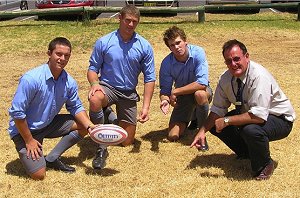 Red Bend Catholic College deputy principal Mark O’Connor and disappointed students (l-r) Zac Redfern, Jake Grace and Lou Goodwin on the college’s hard and dry oval.