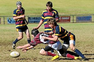 St John’s College’s Ty Huggins appears to have the better of Blayney High’s Alex Turner 