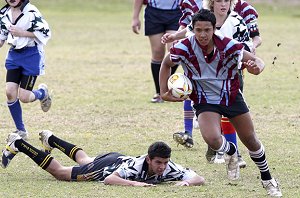 Makaere Bush hits the ball up for Thomas Reddall High School's under-13 team. Picture: Luke Fuda