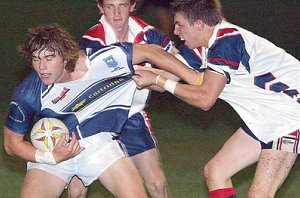 Wagga High’s Jackson Margosis is tackled by Kildare’s Seb Cottam in last night’s Hardy Shield grand final played at Conolly Rugby Park. Picture: Kerrie Stewart