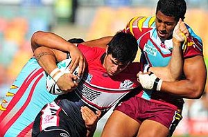 Kirwan's Jai Ingram tries to shrug off a Keebra tackle during yesterday's final. 