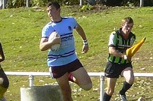 Blockbusting Mackay High Centre Peter Hassall makes a clean break in the early stages of the AA Cup NQ Semi final 2008