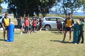 Ross Padget, Jordan Grayston and George Griffin with the kids from Calen Primary School 