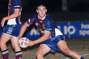 Kelvin Nielsen shapes to pass from dummy-half during Mackay Highs win last night.