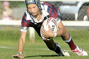 Mackay State Highs Lachy Anderson is tackled by Mackay North State Highs James Popperwell in their year eight clash.