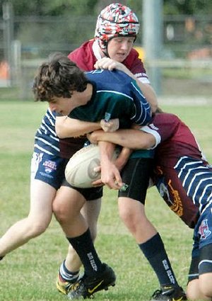 Mercy College’s Denzil Bowen meets strong defence from MSHS in the under-15 schoolboys’ final.